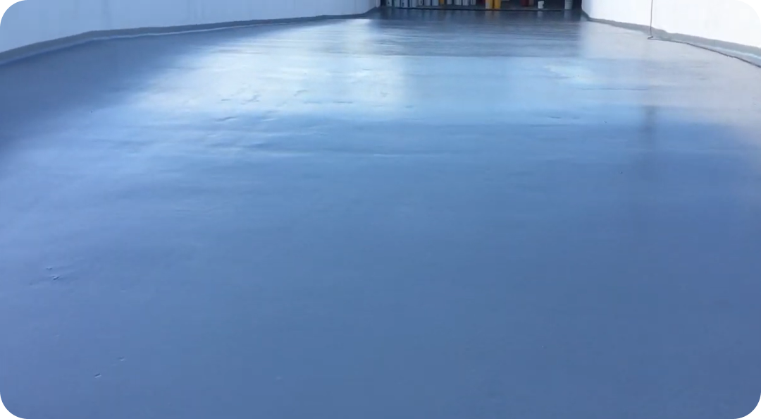 Empty blue indoor floor or rink with walls in the distance