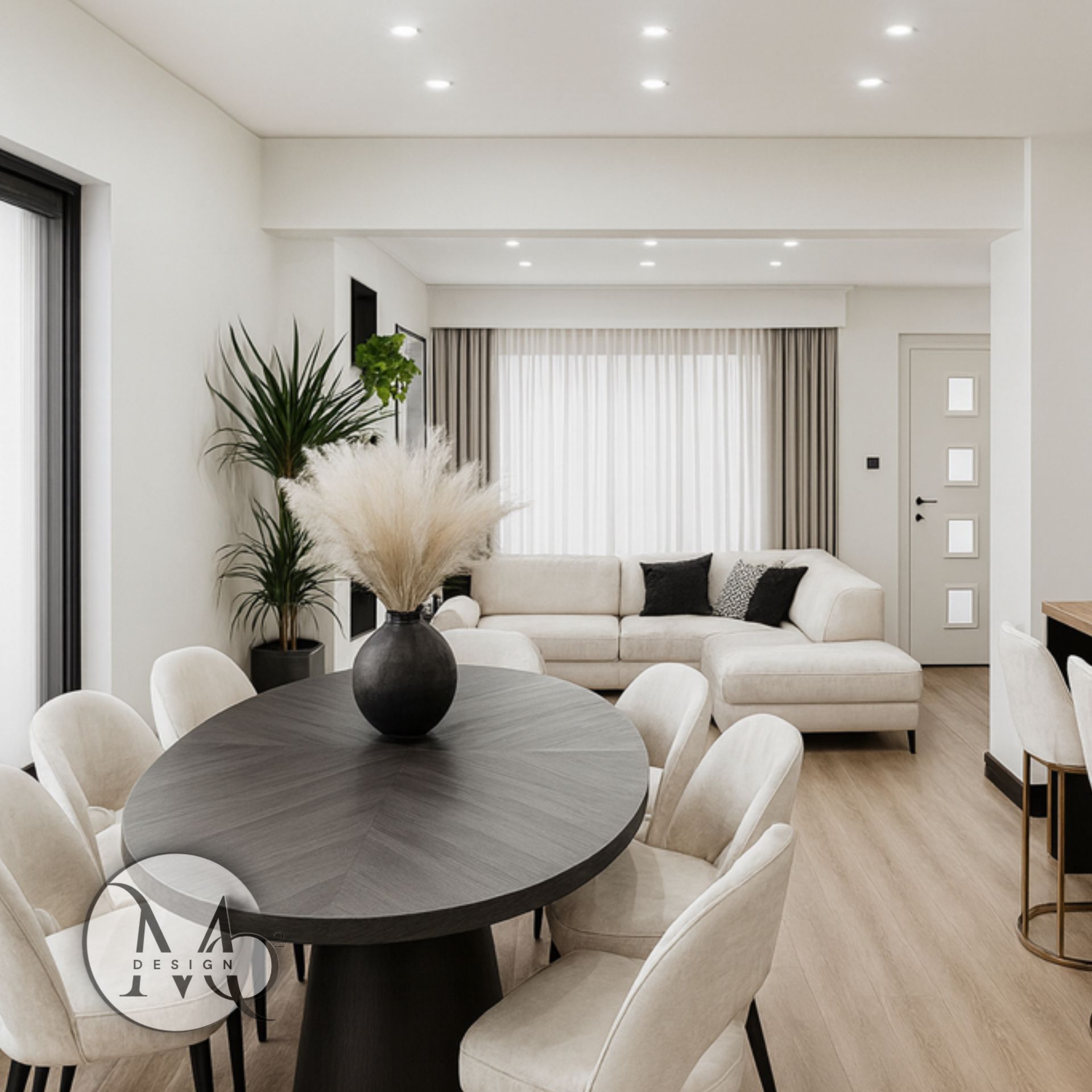 interior design west london Elegant dining room with oval table, cream chairs, and a white sectional sofa.