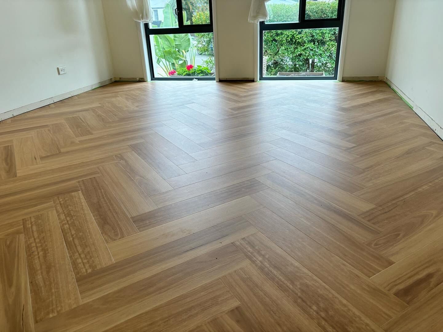 Empty Room With Herringbone Wood Floor — Totally Flooring Gold Coast In Bundall, QLD