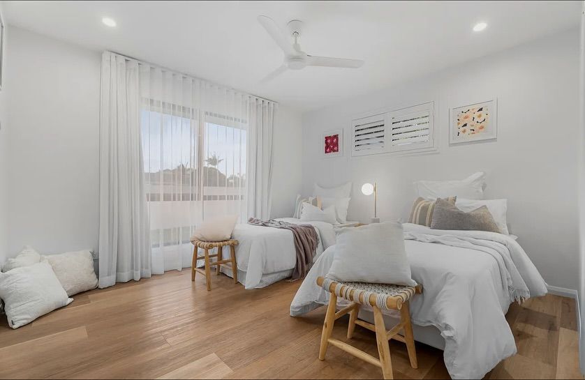 Spacious living room with white sofas — Totally Flooring Gold Coast In Bundall, QLD