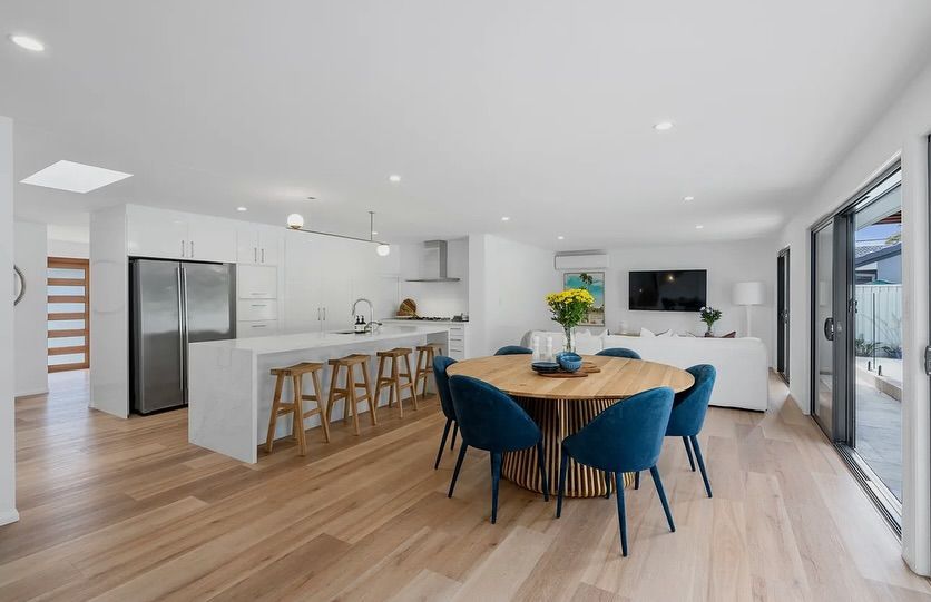Open-plan kitchen and dining area with wooden floors — Totally Flooring Gold Coast In Bundall, QLD