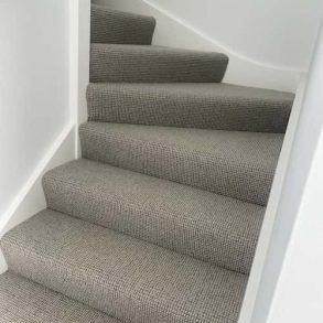 A Set of Stairs With a Gray Carpet on Them — Totally Flooring Gold Coast In Bundall, QLD