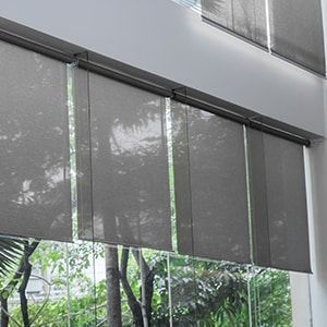 Four Dark Gray Roller Shades Mounted in a Row Over Large Windows — Totally Flooring Gold Coast In Bundall, QLD