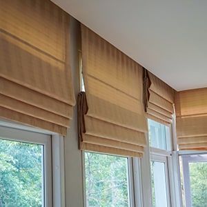 Tan Fabric Roman Shades Installed on Windows — Totally Flooring Gold Coast In Bundall, QLD