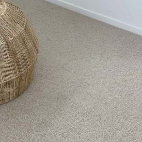 A Wicker Lamp Sitting on Top of a Carpeted Floor — Totally Flooring Gold Coast In Bundall, QLD