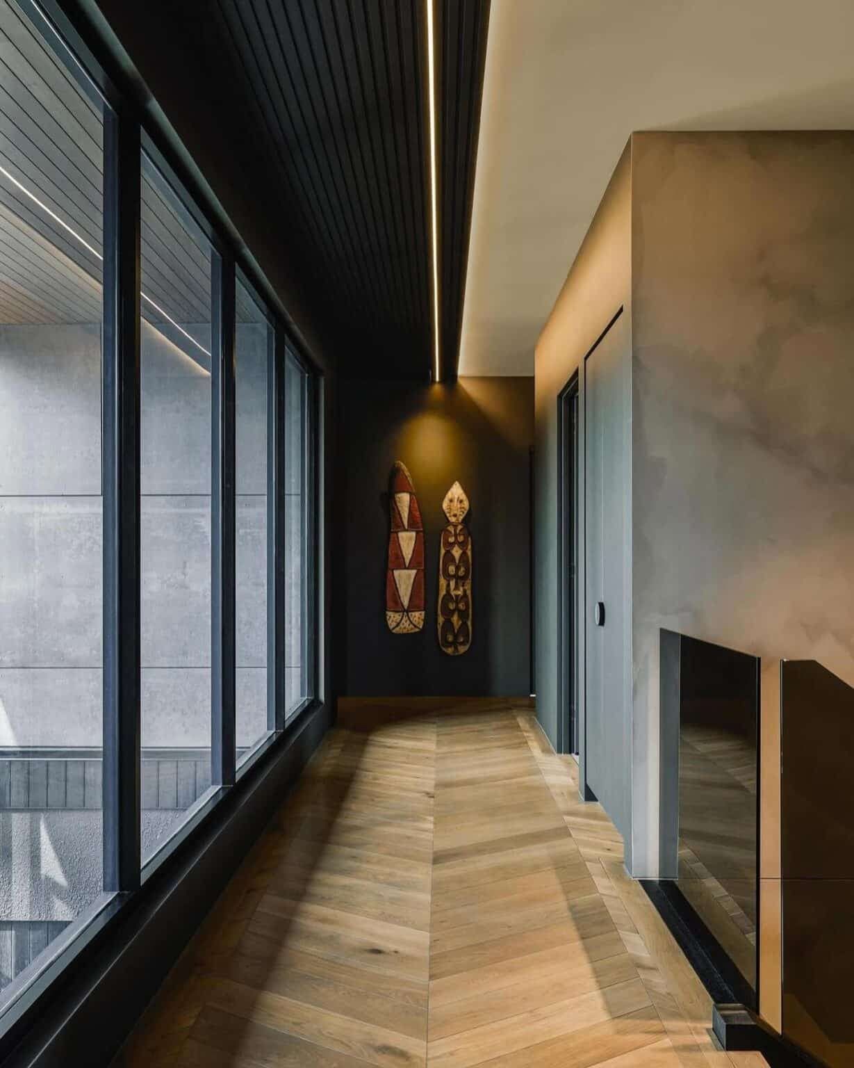 A Hallway With a Lot of Windows and Wooden Floors — Totally Flooring Gold Coast In Bundall, QLD