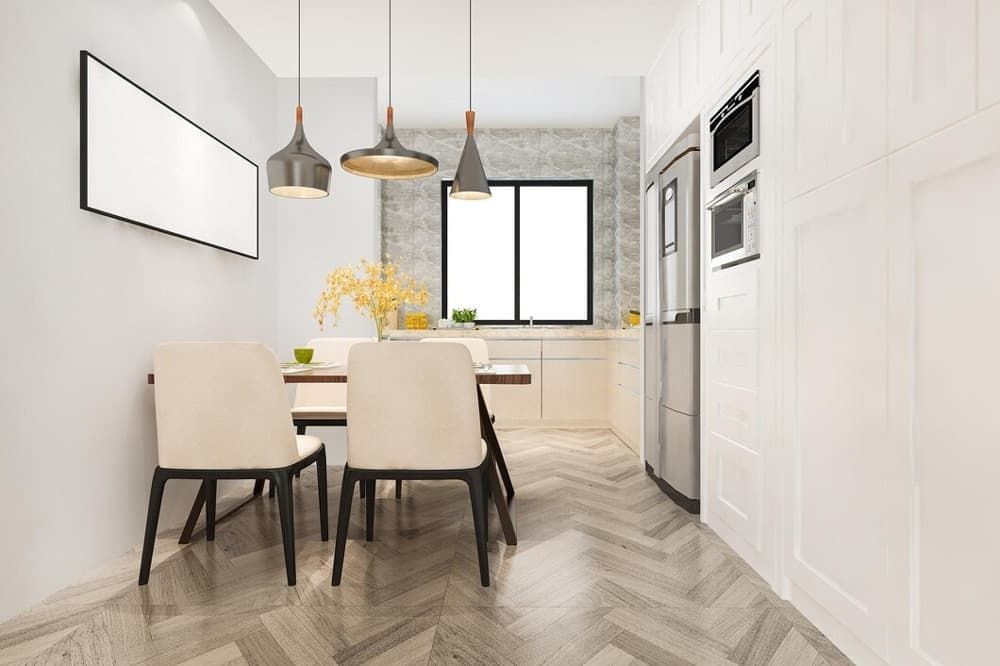 A Kitchen With a Dining Table and Chairs and a Refrigerator — Totally Flooring Gold Coast In Bundall, QLD