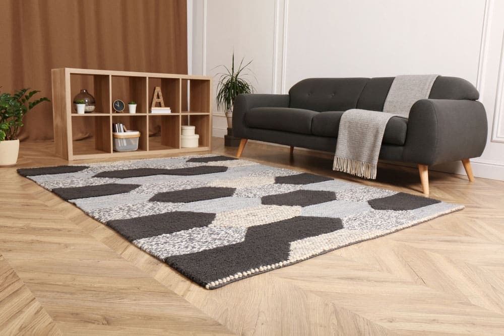 A Living Room With a Couch and a Rug on the Floor — Totally Flooring Gold Coast In Bundall, QLD