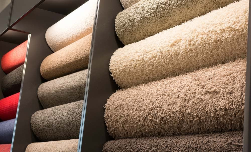 Rolls of Carpet Are Stacked on Top of Each Other in a Store — Totally Flooring Gold Coast In Bundall, QLD