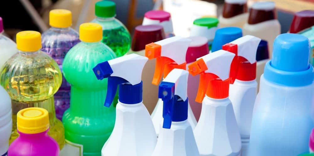 A Group of Spray Bottles Sitting on Top of Each Other on a Table — Totally Flooring Gold Coast In Bundall, QLD