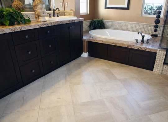 A Bathroom With a Tub, Sink, and Cabinets — Totally Flooring Gold Coast In Jimboomba, QLD
