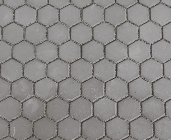 A Close Up of a Gray Hexagon Tile Floor — Totally Flooring Gold Coast In Bundall, QLD