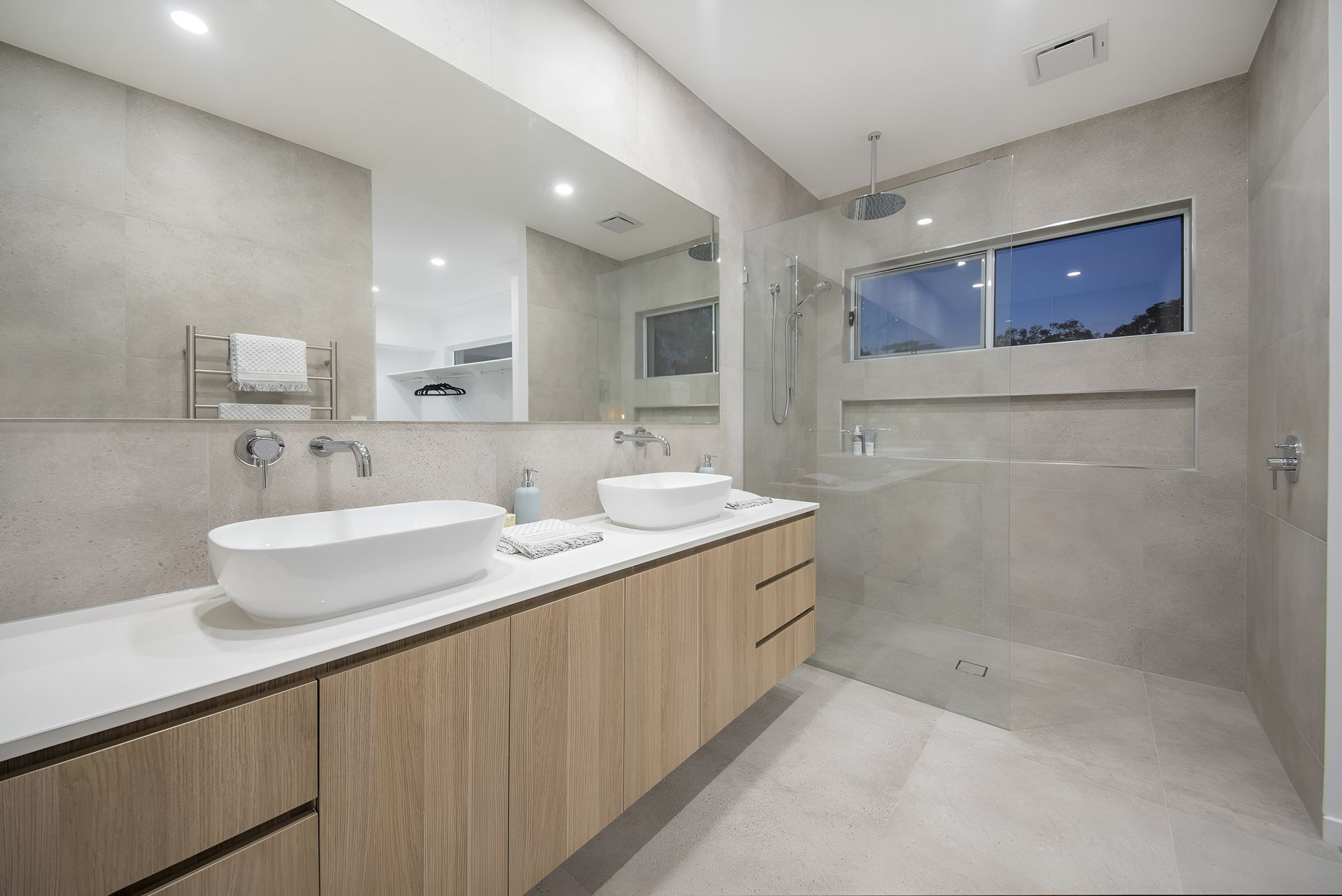 Modern Bathroom with Double Vanity, Large Mirror, Walk In Shower, and Gray Tile Walls and Floor — Totally Flooring Gold Coast In Bundall, QLD