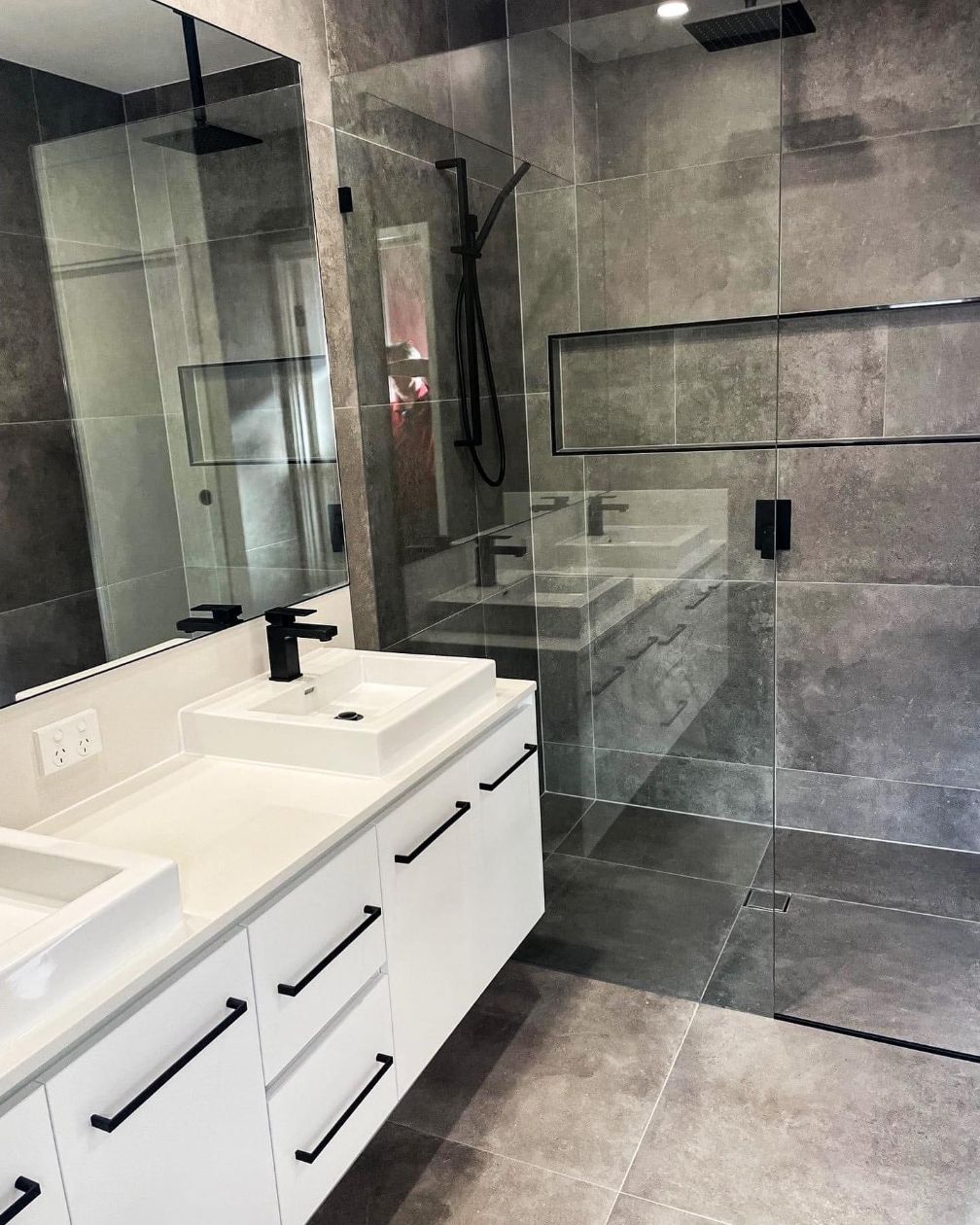 Modern Bathroom With White Vanity, Black Fixtures, Glass Shower — Totally Flooring Gold Coast In Bundall, QLD