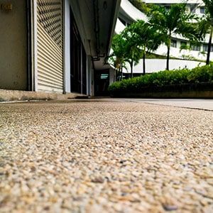 A Close Up of a Sidewalk With a Building in the Background — Totally Flooring Gold Coast In Bundall, QLD