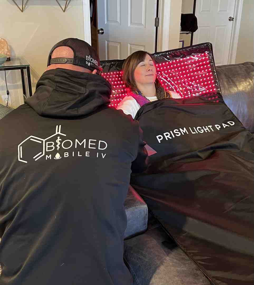 A man and a woman are sitting on a couch.