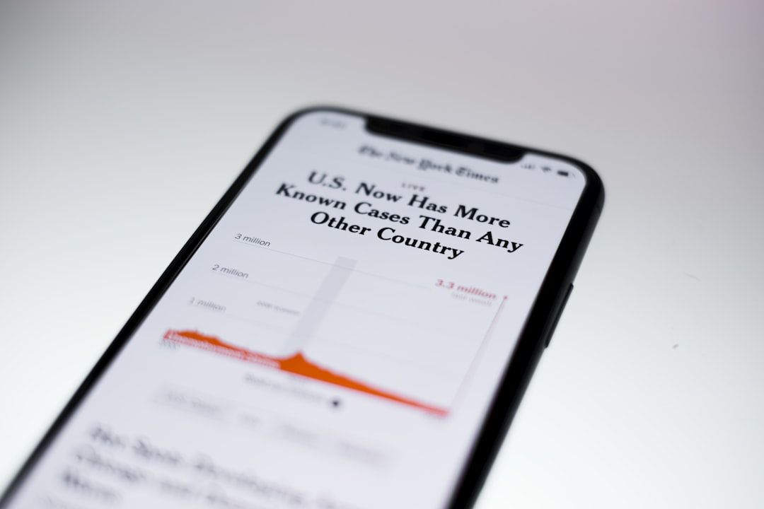A cell phone displays a graph that says u.s. now has more known cases than any other country