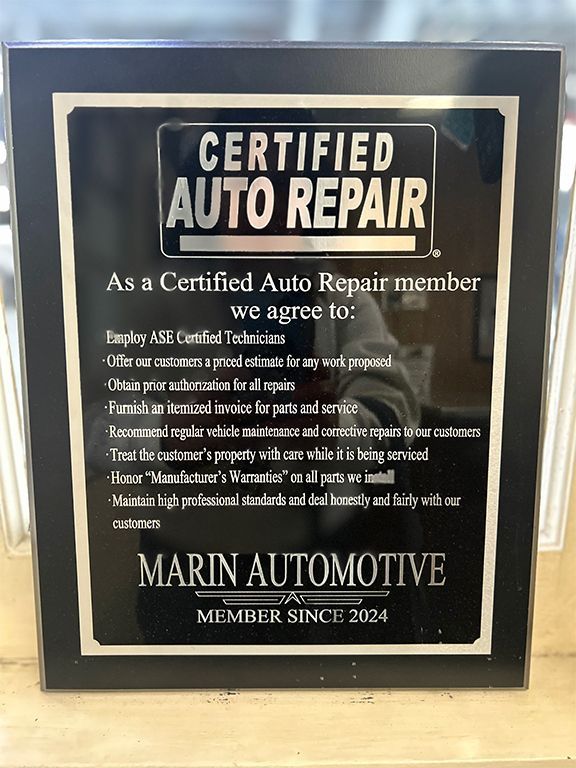 Certified Auto Repair member plaque for Marin Automotive, black and gold sign on wall. | Marin Automotive