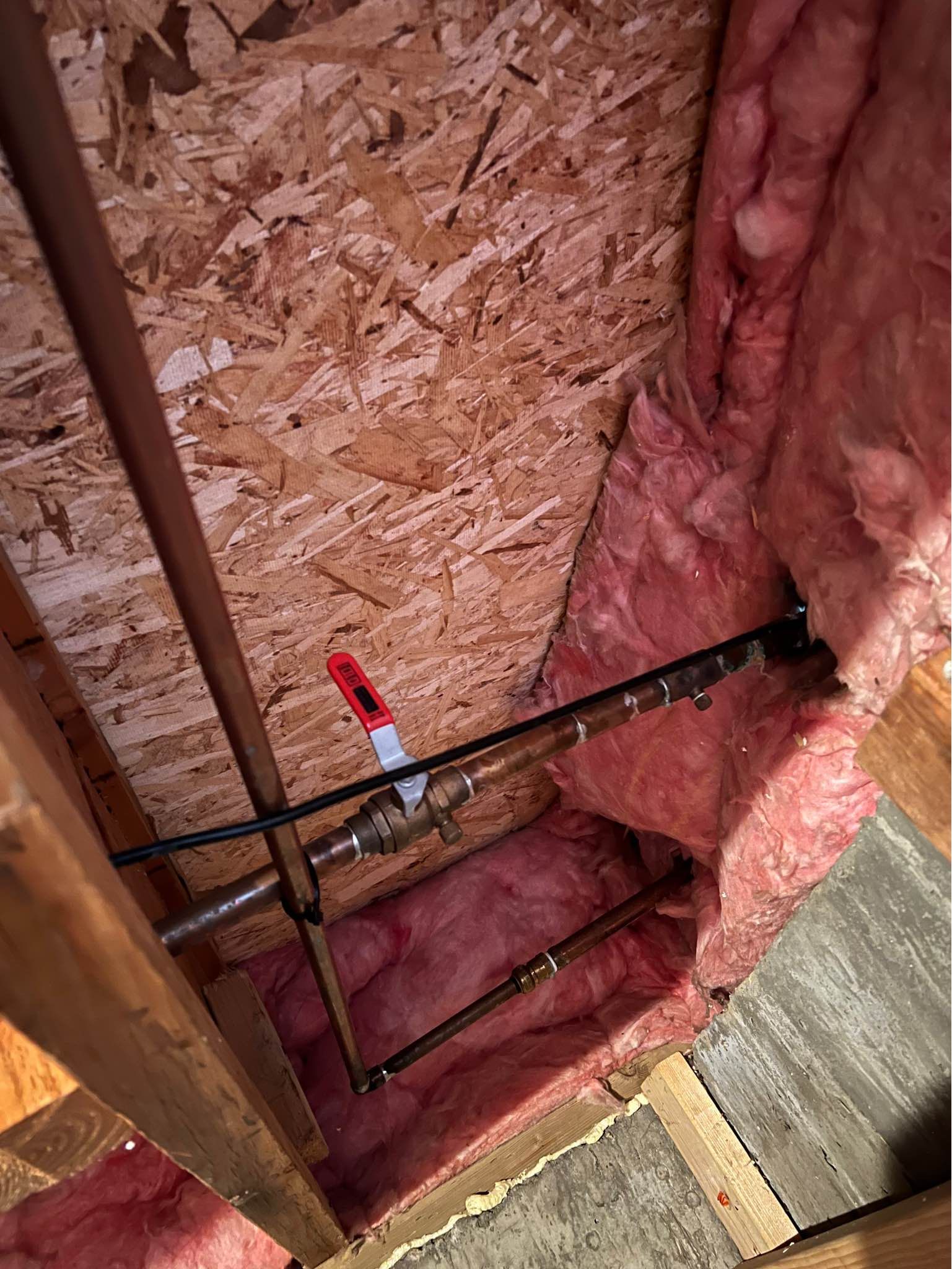 There is a pipe in the ceiling of a house.