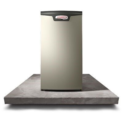 A lennox air conditioner is sitting on top of a concrete platform. A lennox air conditioner is sitting on top of a concrete platform.