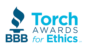 Logo for the Better Business Bureau (BBB) Torch Awards for Ethics, featuring a blue torch icon next to the program name.