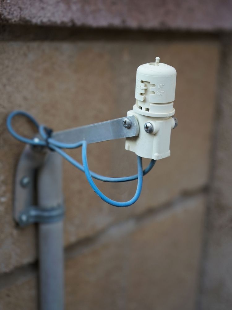 Rain Sensor Installed on the Side of a Building — Irrigation Sensors in Townsville