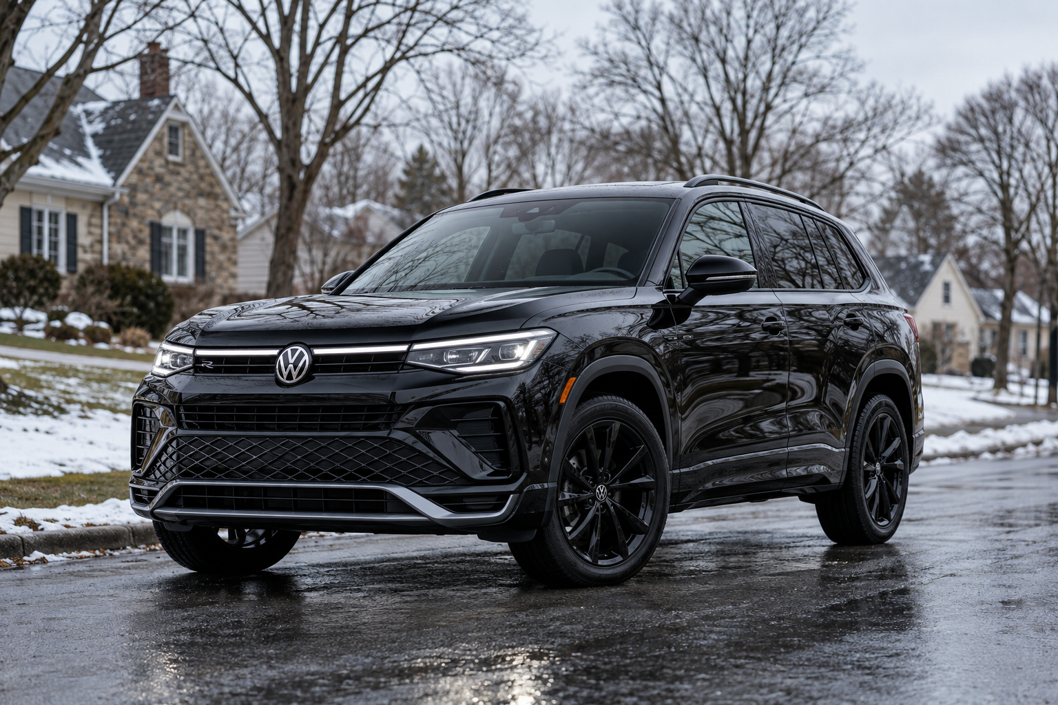 Black Volkswagen SUV parked on a wet street in a snowy neighborhood