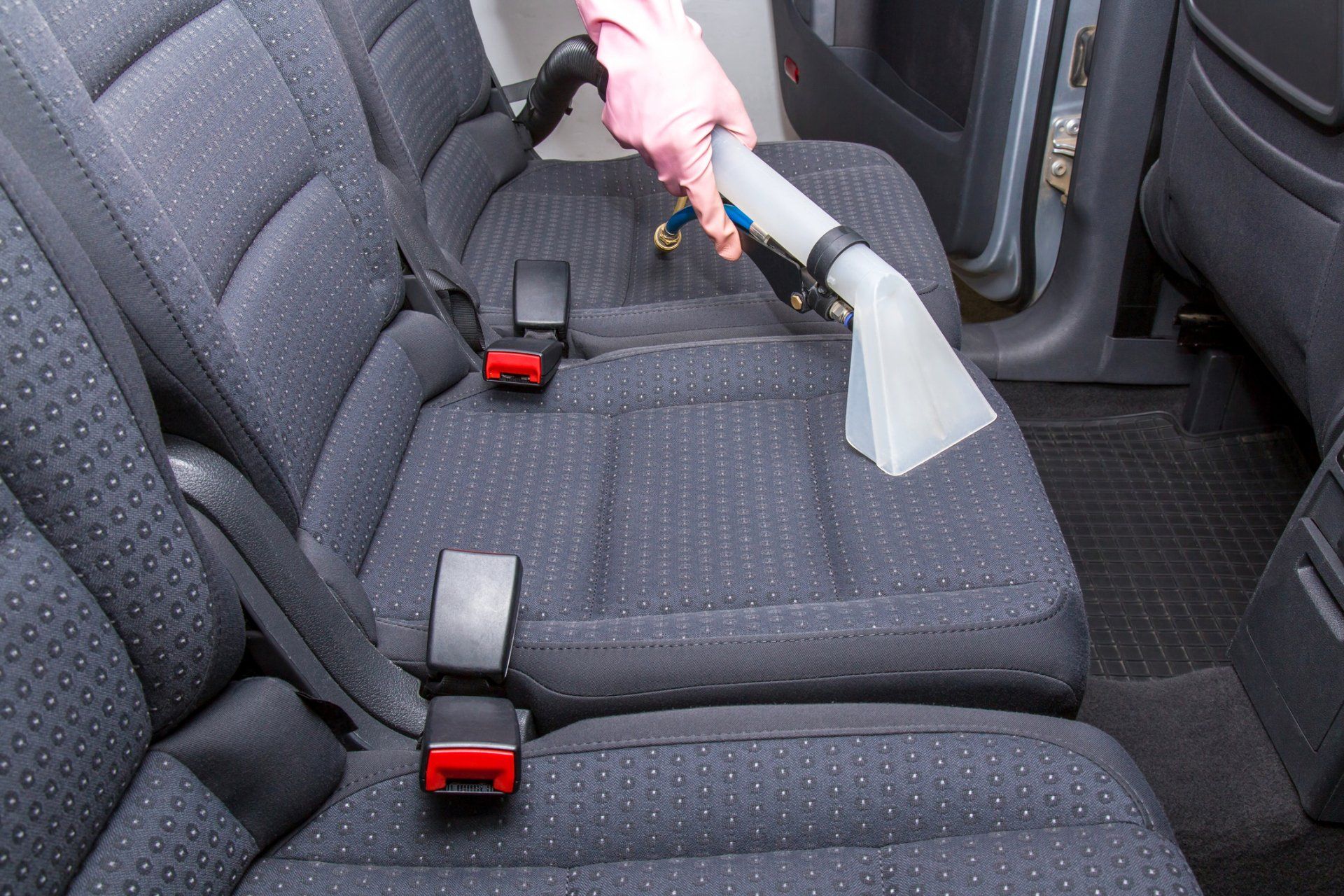 Cleaning car interior using vacuum — Ann Arbor, MI — A2 Auto Image Cleaning car interior using vacuum — Ann Arbor, MI — A2 Auto Image