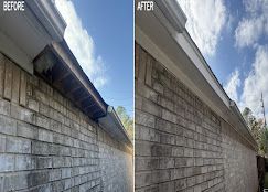 Before-and-after view of a cinder block wall and roof eave, showing cleaning or repair improvement