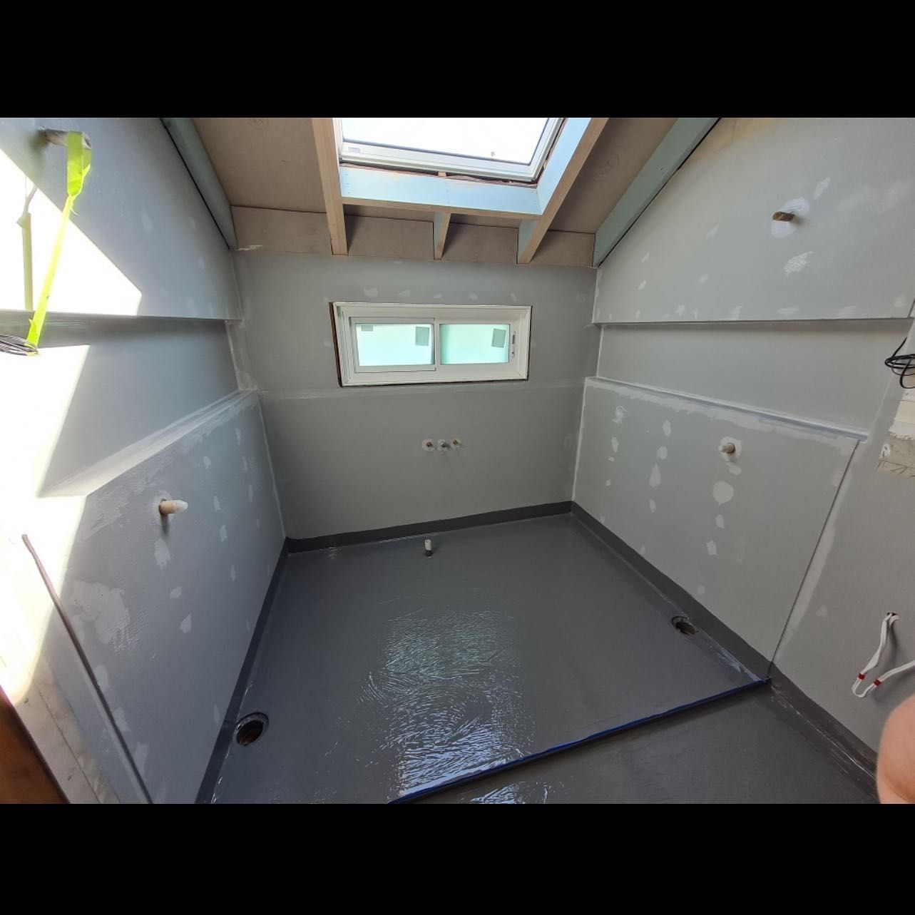 A Bathroom Under Construction With A Skylight And A Window — Coastwide Waterproofing in Hornsby, NSW