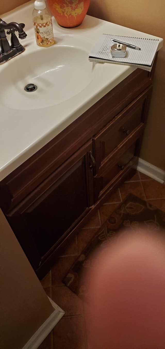 A bathroom sink with a bowl of cereal on top of it.