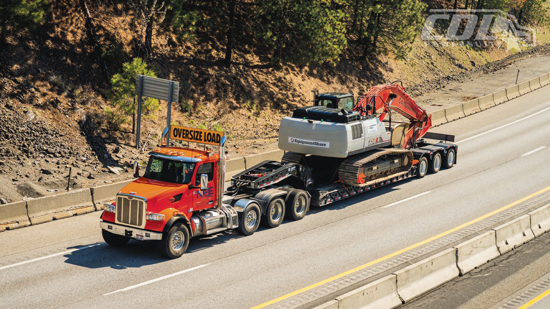 Truck hauling heavy equiptment