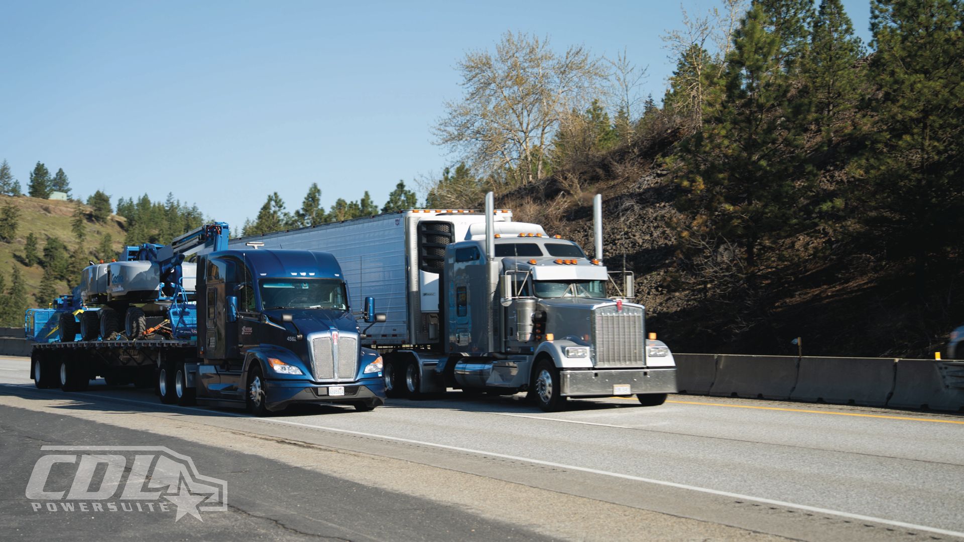 Two Semi Trucks Driving Side by Side