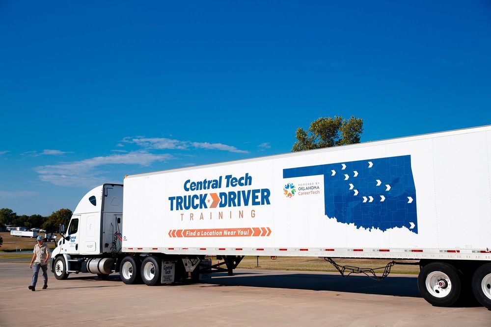 Truck driver training trailer with Central Tech branding parked outdoors under a clear blue sky