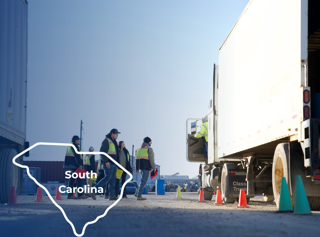 A group of people in high-visibility vests walk near parked semi-trucks, with a Tennessee state outline overlay.