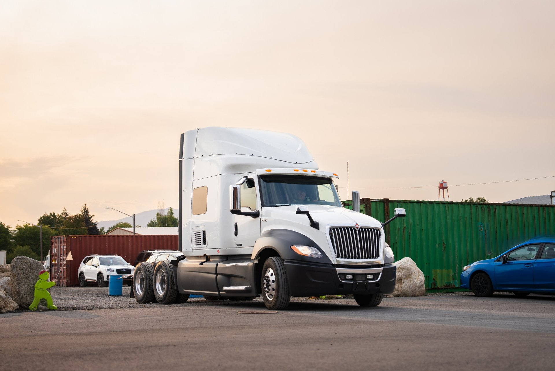 Modern white LT semi truck with sleeper cab at a CDL training school
