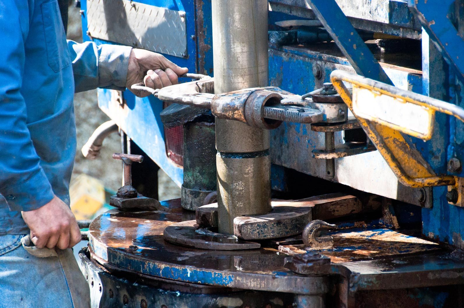 Worker drilling in the ground for water — Elberta, AL — Elberta Pump Repair & Well Drilling, Inc.