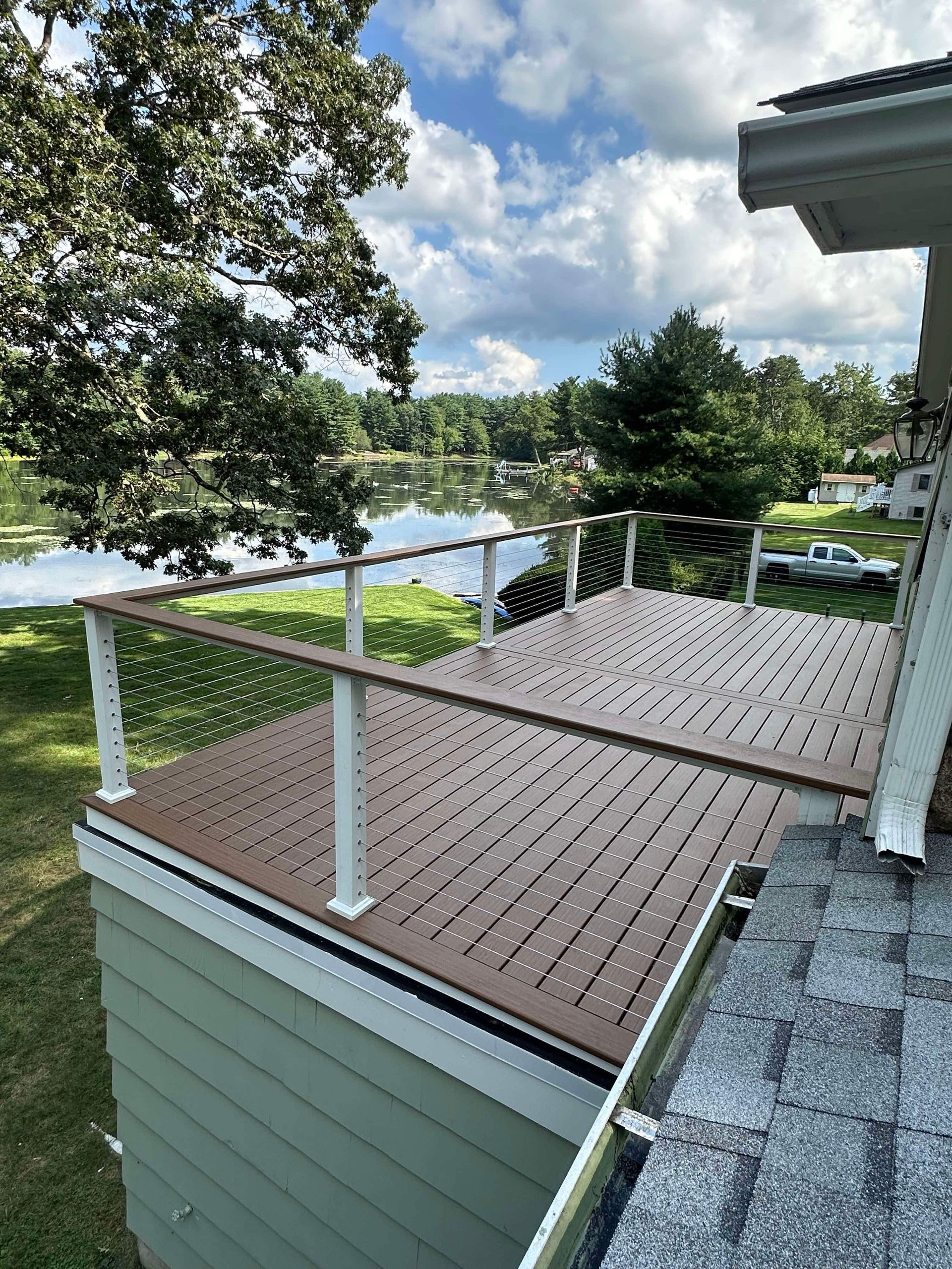 A man is working on the roof of a house.
