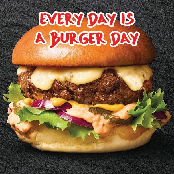 Burger with lettuce, cheese, and red text reading “Every Day Is A Burger Day”
