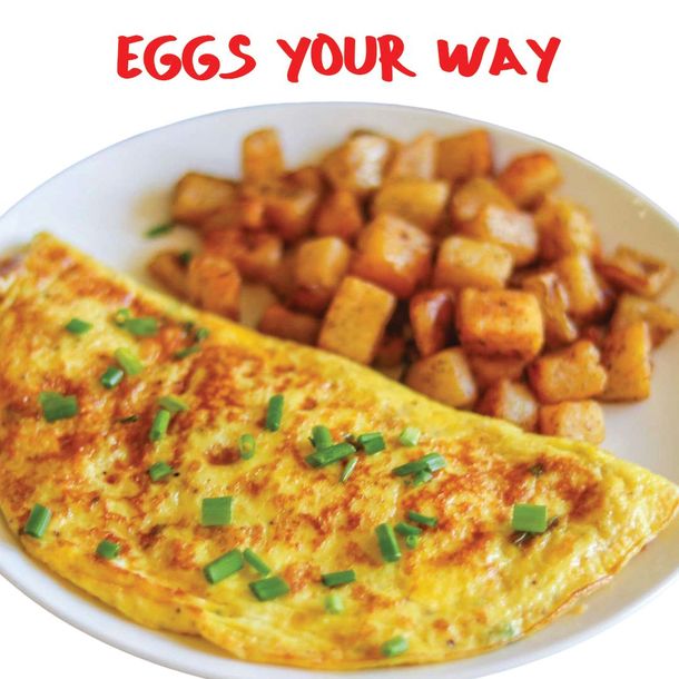 Omelet with chopped chives and browned potato cubes on a plate, with “EGGS YOUR WAY” text above
