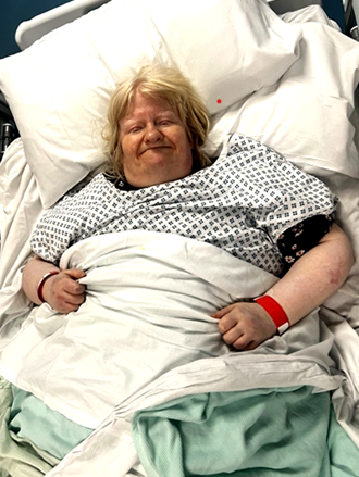 Kate in a hospital bed