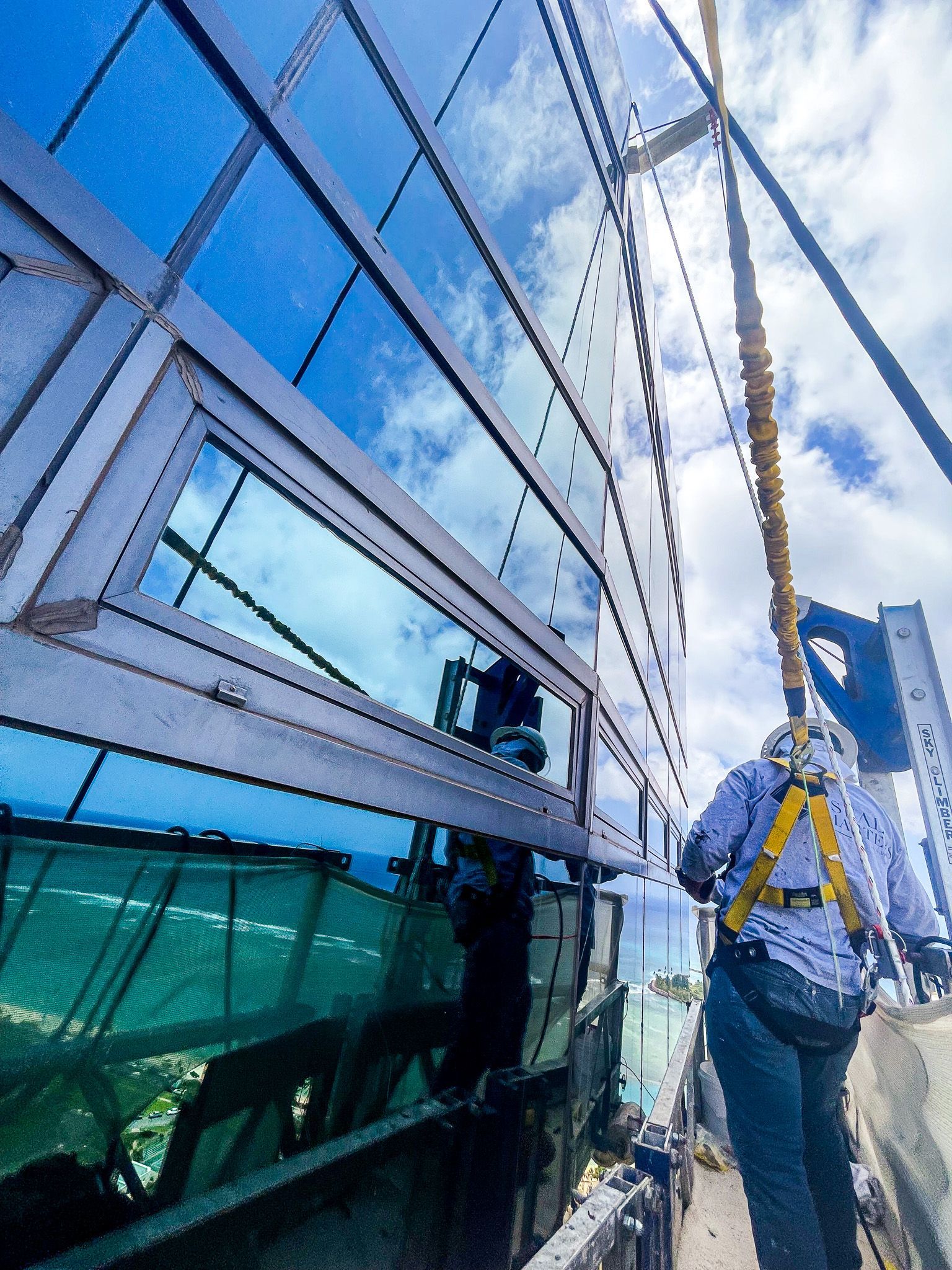 Seal Masters team performing sealant replacement on tower facade