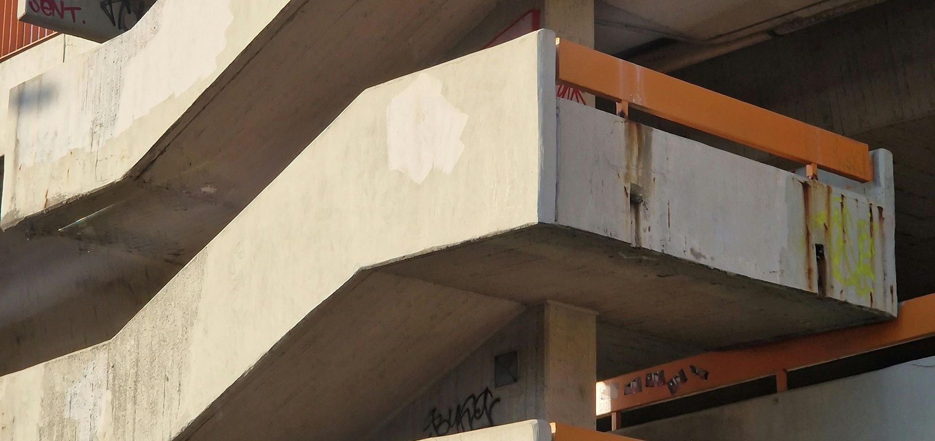 A close up of a building with stairs and balconies