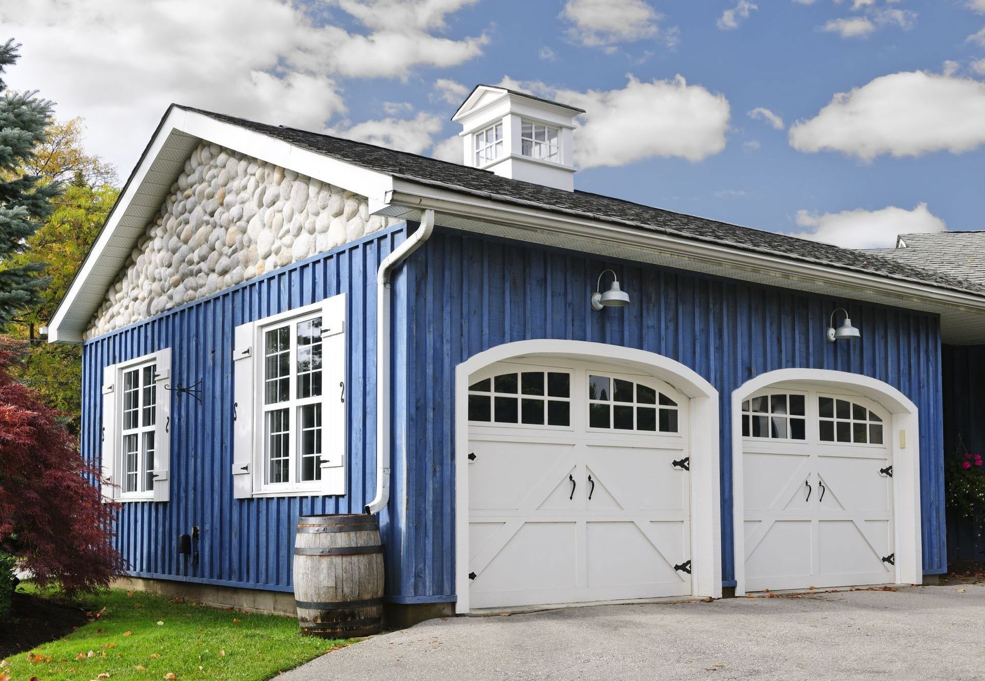 Arched top overlay carriage house garage doors