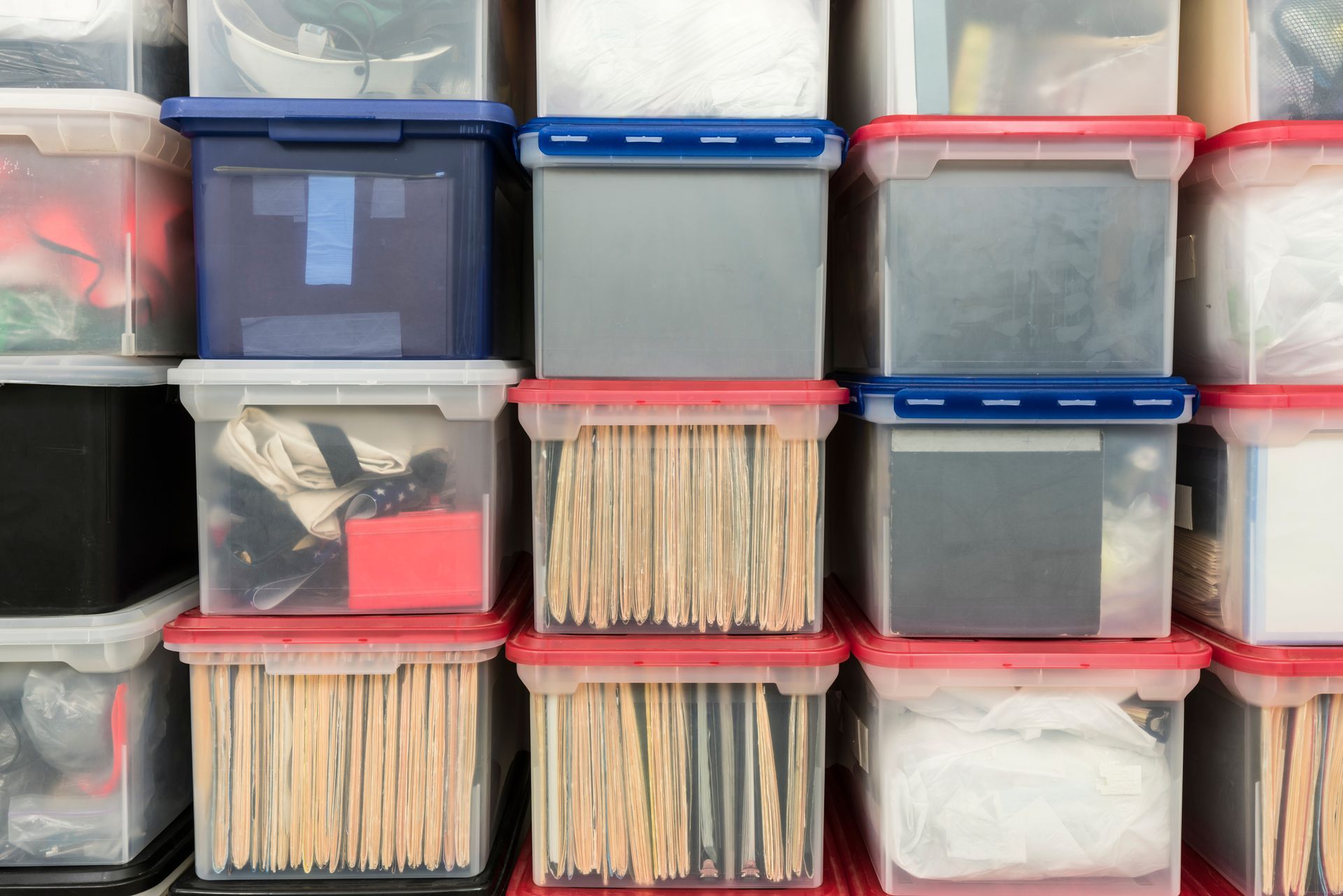 storing items in the garage in plastic containers to keep bugs out of the garage