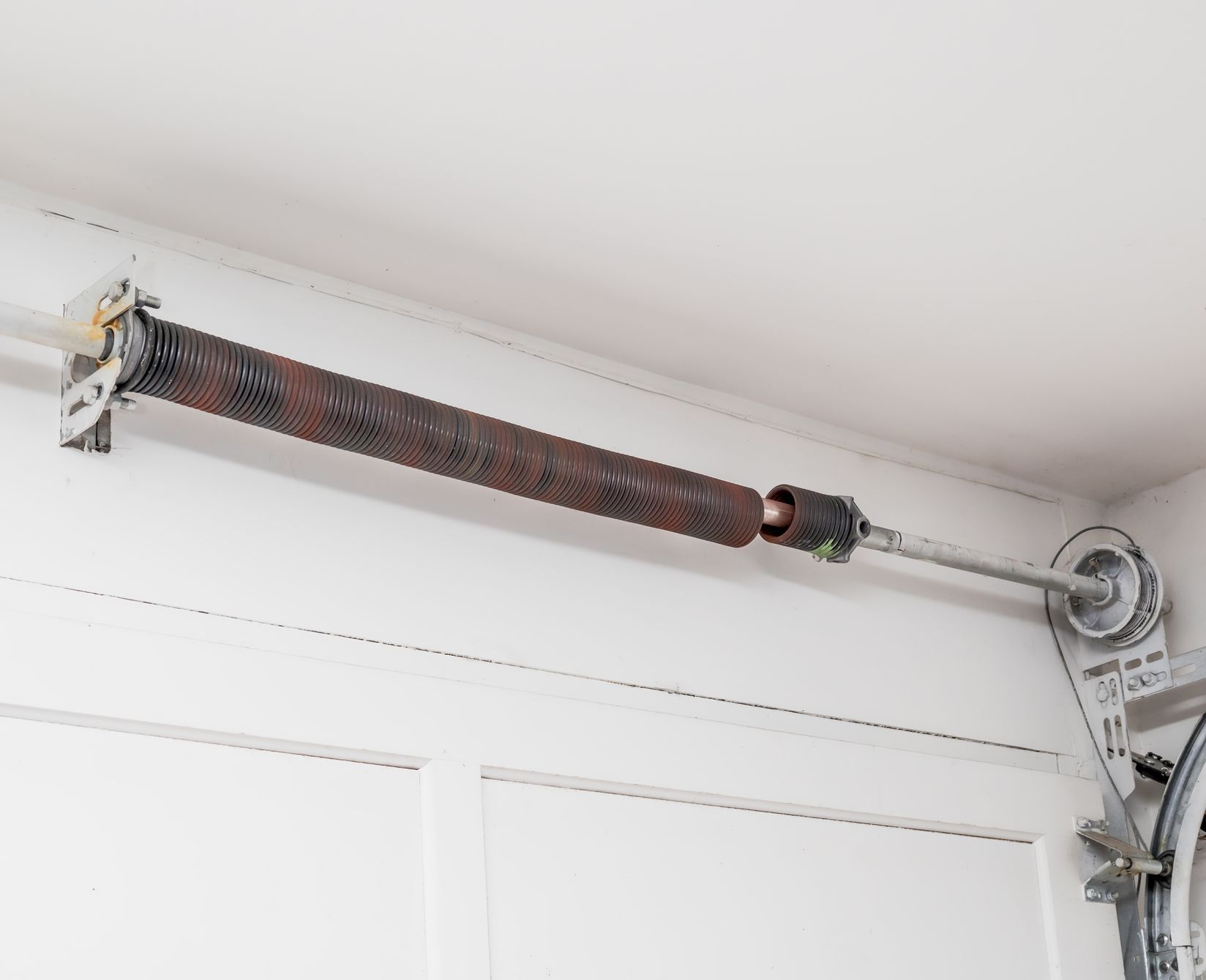 tension spring at the top of the garage door, interior
