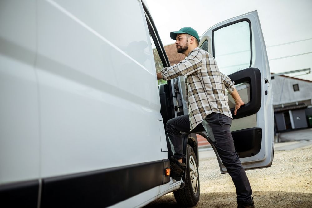 A Man Is Entering Into A White Van — ABC Driving School Central Coast In Umina Beach, NSW