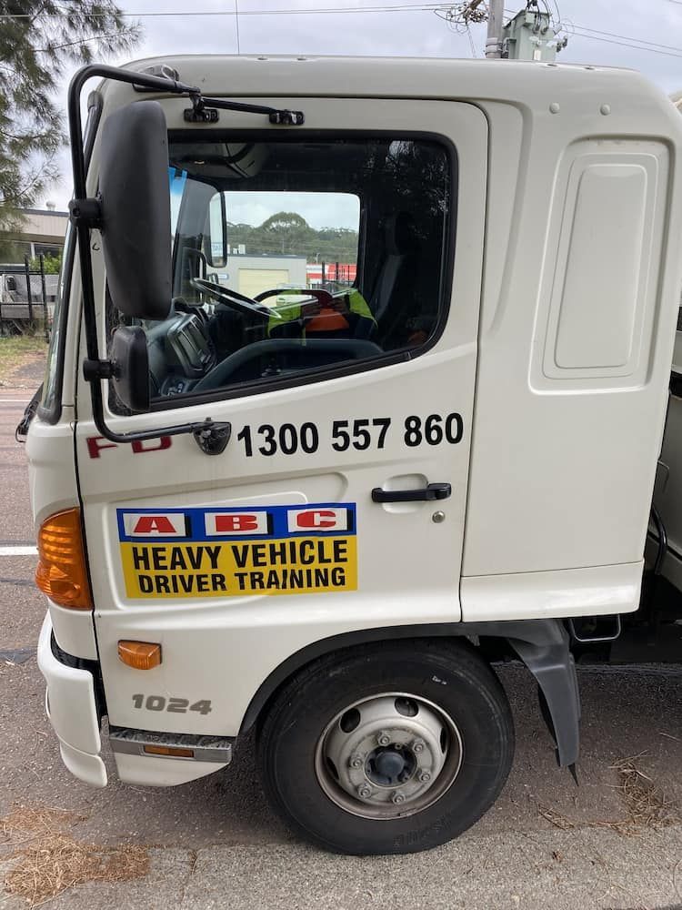 A White Truck With A Sticker On The Door — ABC Driving School Central Coast In Umina Beach, NSW
