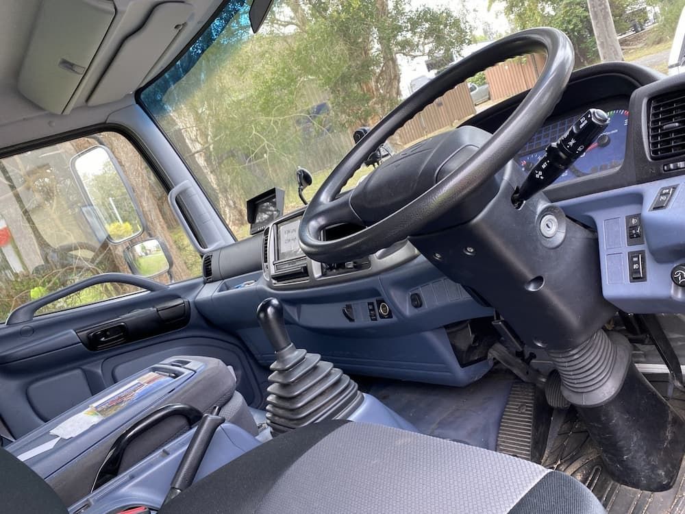 A Close Up Of The Interior Of A Truck With A Steering Wheel — ABC Driving School Central Coast In Umina Beach, NSW