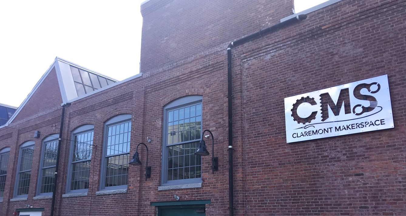A brick building with a sign that says cms on it